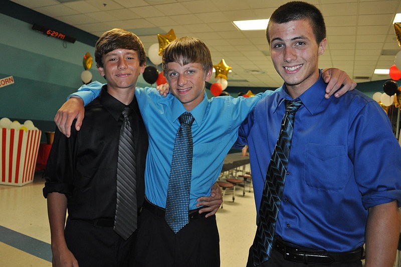 Eduardo Ronderos, Jamie Jeffcoat and Kyle Kimpton had fun mingling with friends.