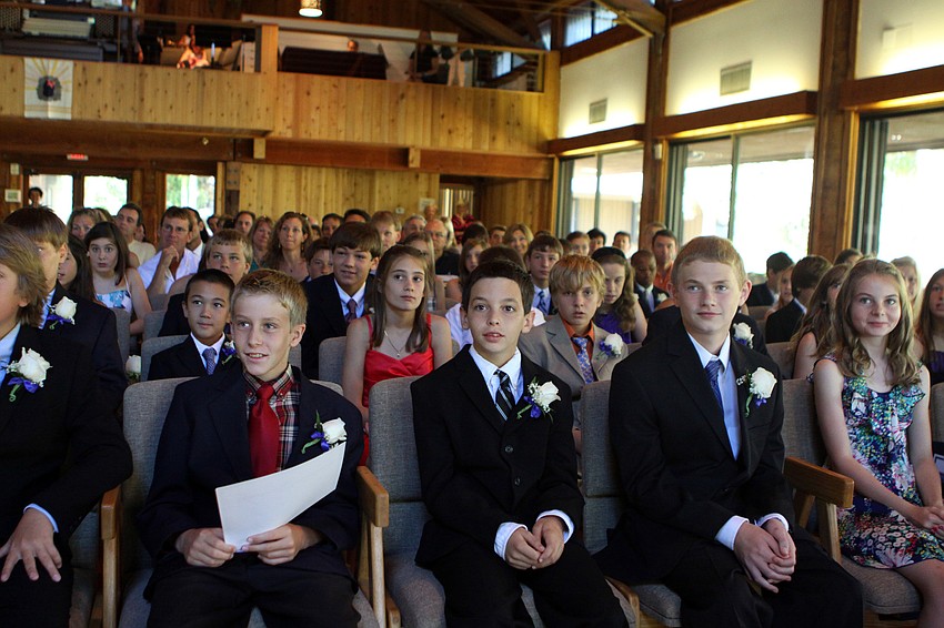 Students smile and listen to Ken Melber speak Friday, June 3 during ODA's 6th grade graduation at Siesta Key Chapel. This was Melber's final year at ODA and he will be heading back to England.
