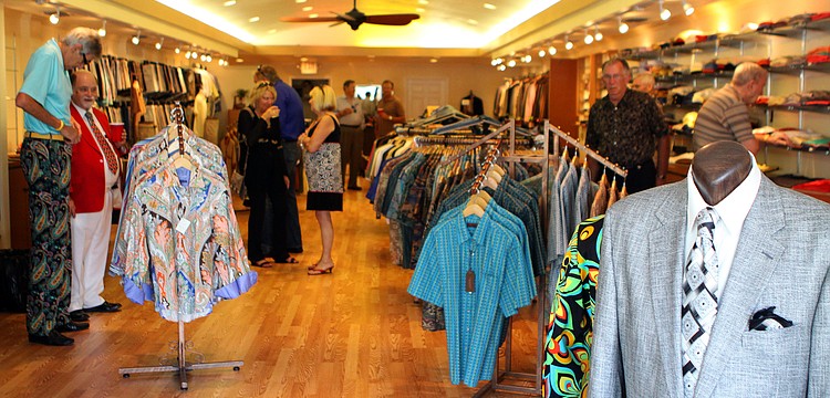 People enjoy wandering around inside the new store Friday, June 3 during Taffy's grand opening at his new store front on St. Armands.