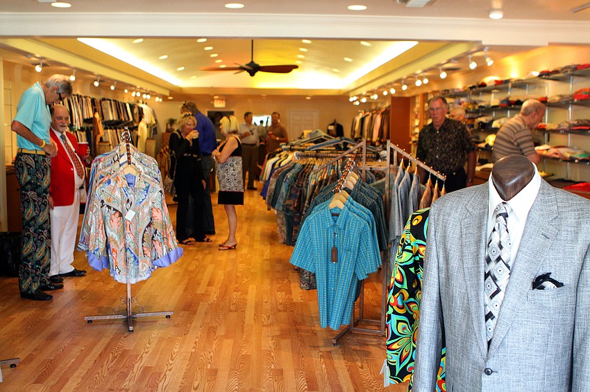People enjoy wandering around inside the new store Friday, June 3 during Taffy's grand opening at his new store front on St. Armands.