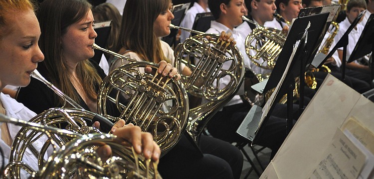 The Riverview High School Marching Band played on as students, families and friends packed into Robarts Arena Saturday to wish RHS's Class of 2011 well.