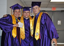 Cody Taylor, Keith Summerall and Eric Kay are pumped up to cross the stage and receive their diplomas.