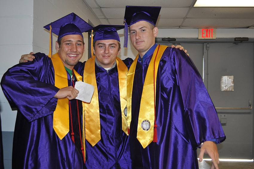 Cody Taylor, Keith Summerall and Eric Kay are pumped up to cross the stage and receive their diplomas.