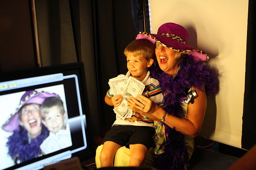 Terri Bauer and nephew, Joshua DeCrapio, 5, pose in the Fotos-R-Fun LLC booth at the annual National Cancer Survivors Day celebration Sunday, June 5 at Michael's on East. Bauer has been cancer free for eight years.
