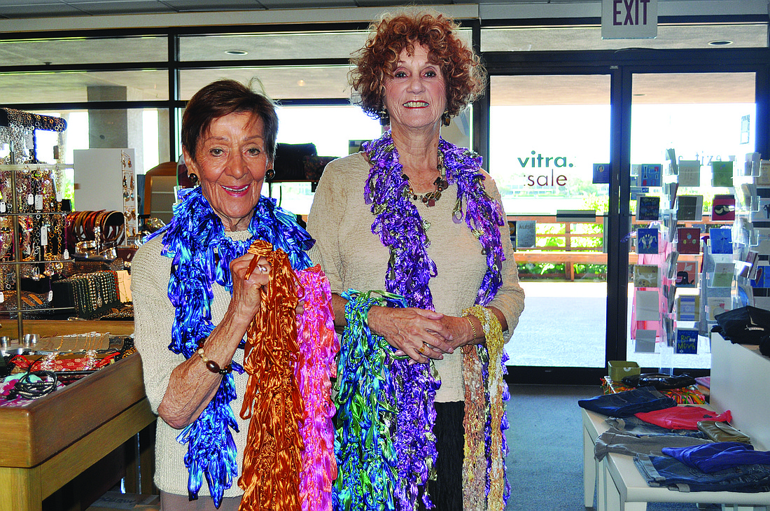 Joyce Rubin and Sheila Weiser model their handmade scarves, which are for sale at Exit ArtÃ¢â‚¬â„¢s Chart House location to benefit PAMFF.