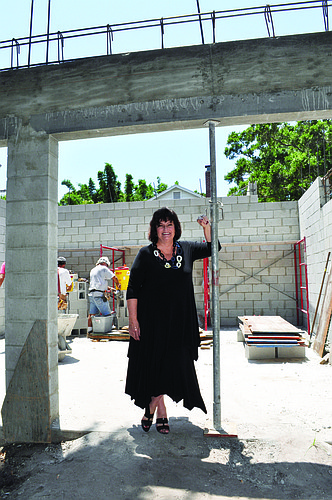 Rock Solid Construction Group President Marjorie Broughton stands on the job site of a custom home the company is building.