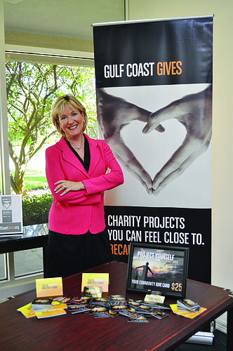Gulf Coast Community Foundation of Venice President and CEO Teri Hansen shows off one of their projects, Gulf Coast Gives, and its give cards.