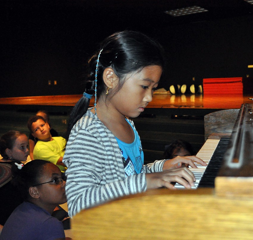 Third-grader Irene Chung played a pair of songs on the piano.