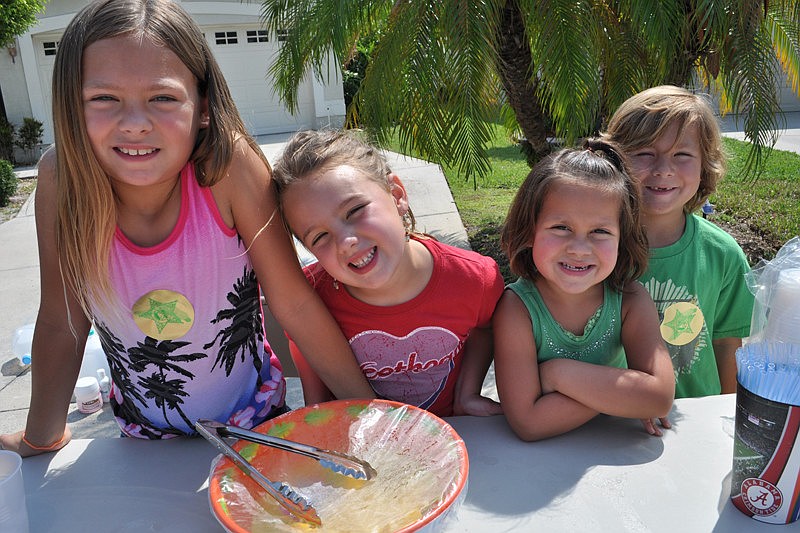 Taylor Ferber, Madisyn Wandall, Rilyn Ferber and Danny Ferber sold lemonade to raise money for a child with cancer.