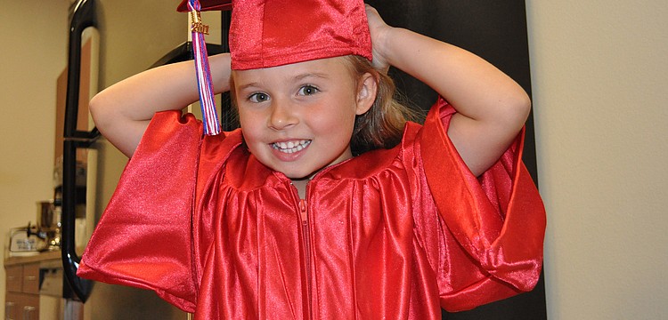 Five-year-old Nyah Andrews couldn't wait to put on her cap and gown.