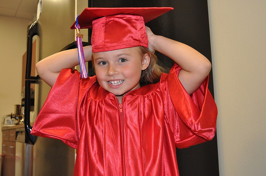 Five-year-old Nyah Andrews couldn't wait to put on her cap and gown.