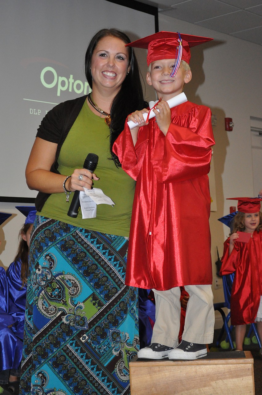 Five-year-old Brayden Sullivan enjoyed celebrating his achievement with his teacher, Christa Roberts.