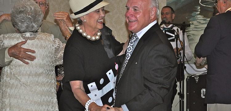 Nell and Bill Martin romance one another on the dance floor.