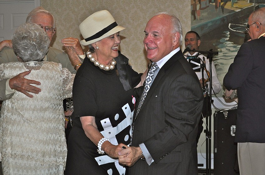 Nell and Bill Martin romance one another on the dance floor.
