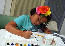 Hannah Rudo, 6, works on painting in her name written out in Greek letters Tuesday, June 14 during the It's All Greek To Me! summer art class at Art Center Sarasota.