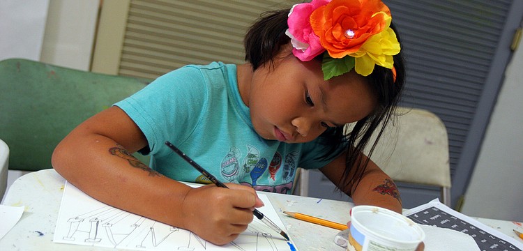 Hannah Rudo, 6, works on painting in her name written out in Greek letters Tuesday, June 14 during the It's All Greek To Me! summer art class at Art Center Sarasota.