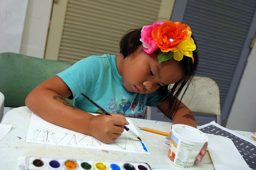 Hannah Rudo, 6, works on painting in her name written out in Greek letters Tuesday, June 14 during the It's All Greek To Me! summer art class at Art Center Sarasota.