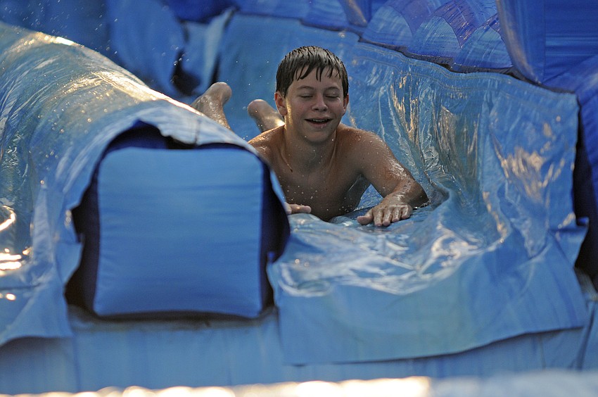 Hunter Thompson, 12, made several trips down the water slide.