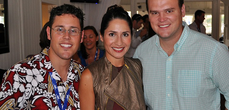 Frank Maggio poses with Desiree and Jason Chachula Friday, June 17 at the wrap party following the YPG Annual Conference/SUM+ at the Hyatt Regency Sarasota's Boathouse.