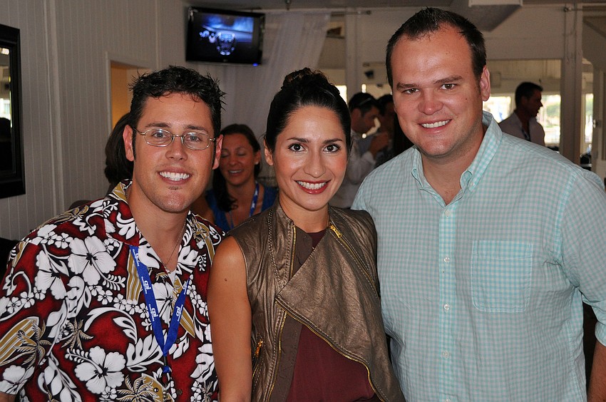 Frank Maggio poses with Desiree and Jason Chachula Friday, June 17 at the wrap party following the YPG Annual Conference/SUM+ at the Hyatt Regency Sarasota's Boathouse.