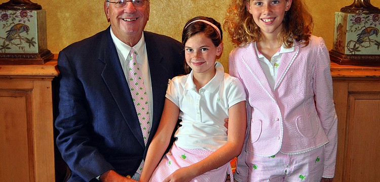 Dr. Keith Brooks poses with his daughters, Blythe, 9, and Cogan, 11, in matching Lilly attire at the Father's Day Brunch Sunday, June 19 at the Oaks Club.
