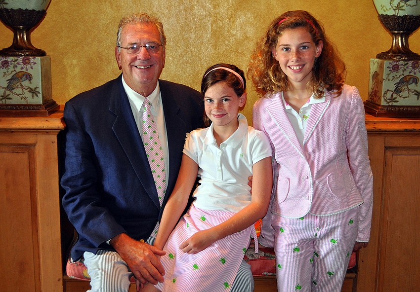 Dr. Keith Brooks poses with his daughters, Blythe, 9, and Cogan, 11, in matching Lilly attire at the Father's Day Brunch Sunday, June 19 at the Oaks Club.