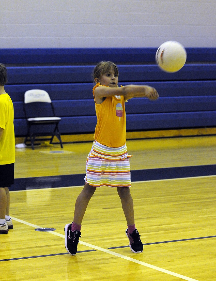 Seven-year-old Anna Berkes enjoyed showing off her volleyball skills.