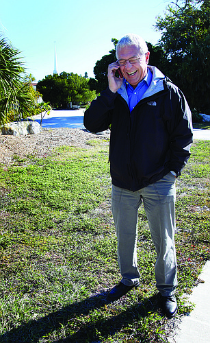 Jimmy Eatrides stands on the Longboat Island Chapel property, where the cell tower would be erected.