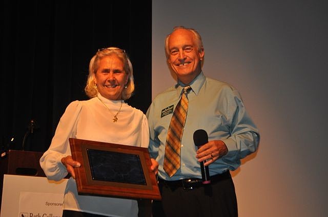 Lee Fox, Save Our Seabirds, accepts the non-profit award from Dennis Hassell.