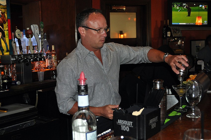 Lakewood Ranch Medical Center CEO Jim Wilson poured drinks to help raise money for the Eddie Livingston Fund.