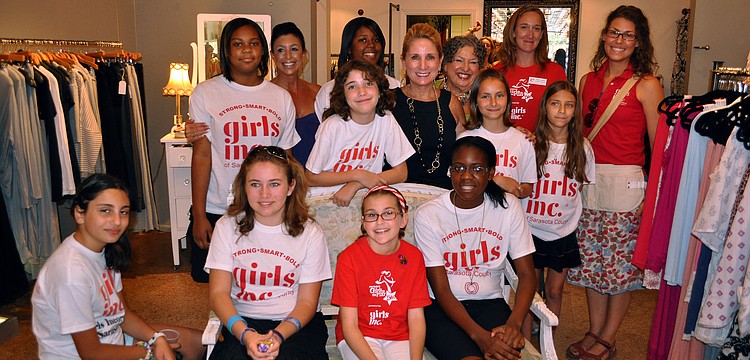The girls and women involved in the Girls Inc.Credible summer camp at Girls Inc. pose Saturday, June 25 inside Lotus, one of the five stores on Main Street that allowed the girls to try sell their own creations.