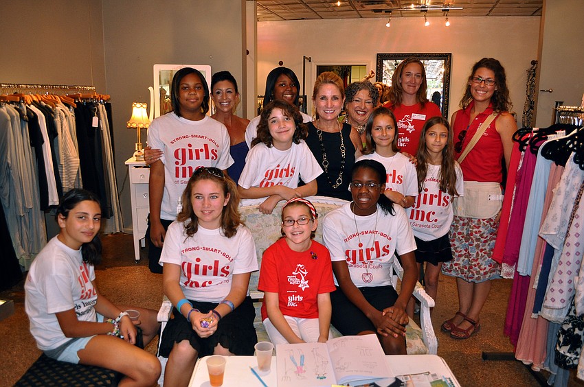 The girls and women involved in the Girls Inc.Credible summer camp at Girls Inc. pose Saturday, June 25 inside Lotus, one of the five stores on Main Street that allowed the girls to try sell their own creations.