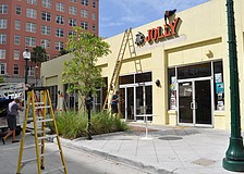 Men were hard at work this morning adding awnings to the Cafe Epicure/Jolly building.