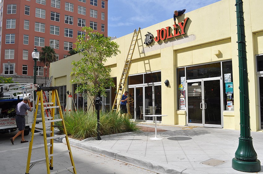 Men were hard at work this morning adding awnings to the Cafe Epicure/Jolly building.