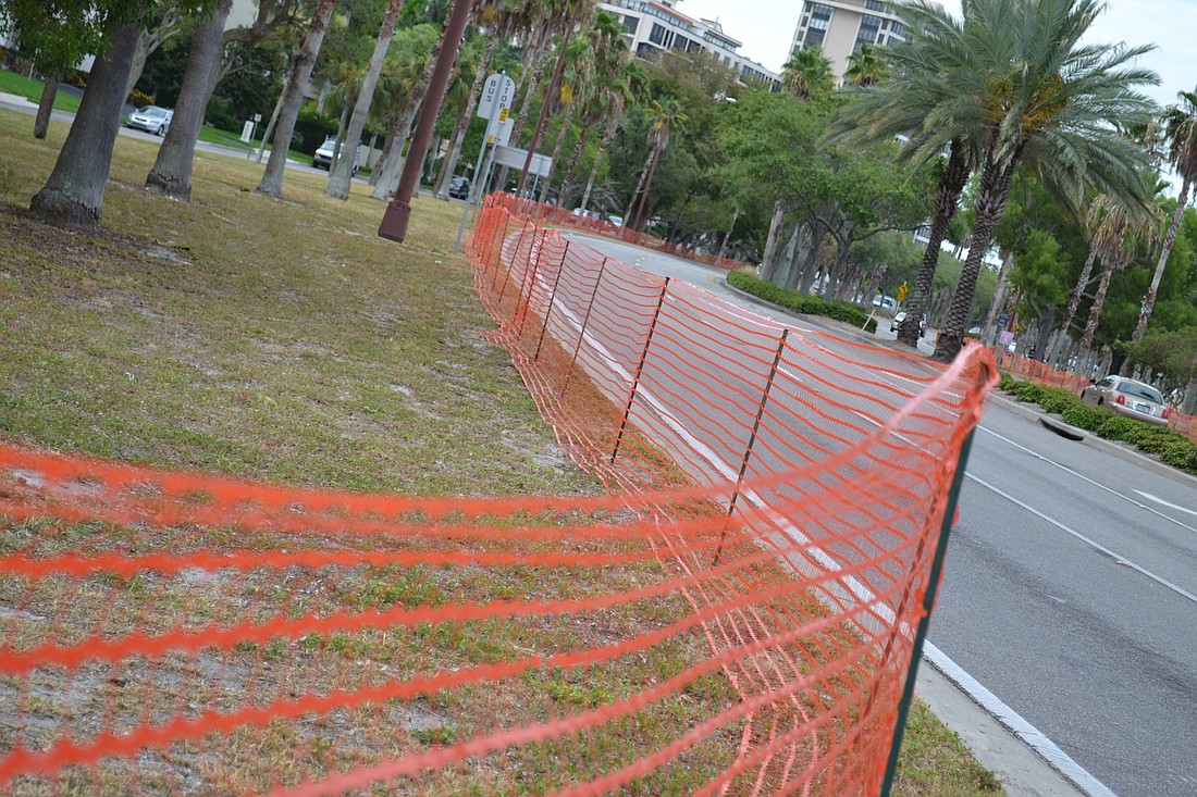 Temporary fencing is being placed along U.S. 41 on the bayfront.