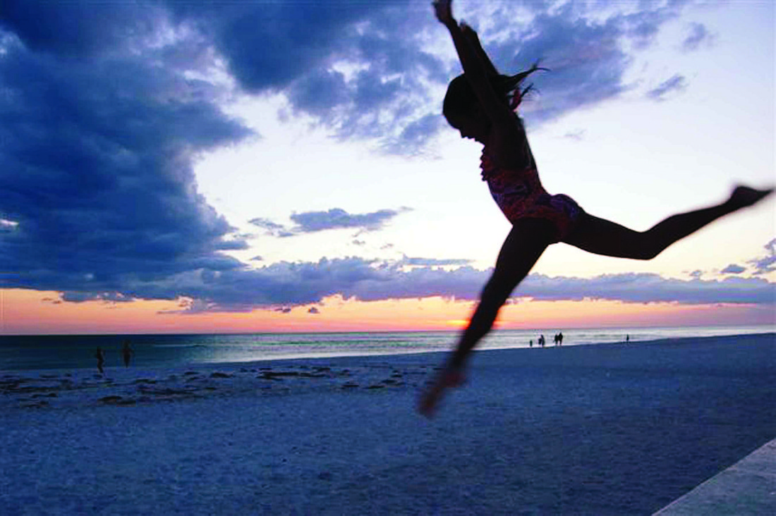 University Park Country Club resident Giovanni DeCastro shot this sunset photo of his daughter, Emma, 8, Memorial Day weekend on Lido Beach.