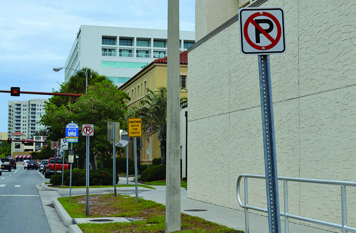 This photo of Ringing Boulevard, in front of the county jail, shows three no-parking signs within about 30 feet, as well as four other signs in the same space.