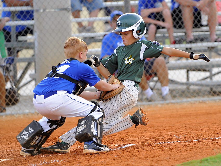 Lakewood Ranch Little Leagueâ€™s Matt Gelorme gets caught trying to reach home plate.