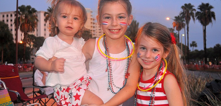 Khloe, 1, Kendall, 8, and Kate, 5, Campion pose together along Tamiami Trail prior to the start of the Bayfront Fireworks Spectacular Monday, July 4 over the Sarasota Bay.