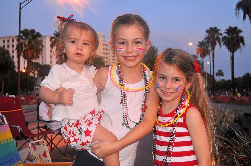 Khloe, 1, Kendall, 8, and Kate, 5, Campion pose together along Tamiami Trail prior to the start of the Bayfront Fireworks Spectacular Monday, July 4 over the Sarasota Bay.