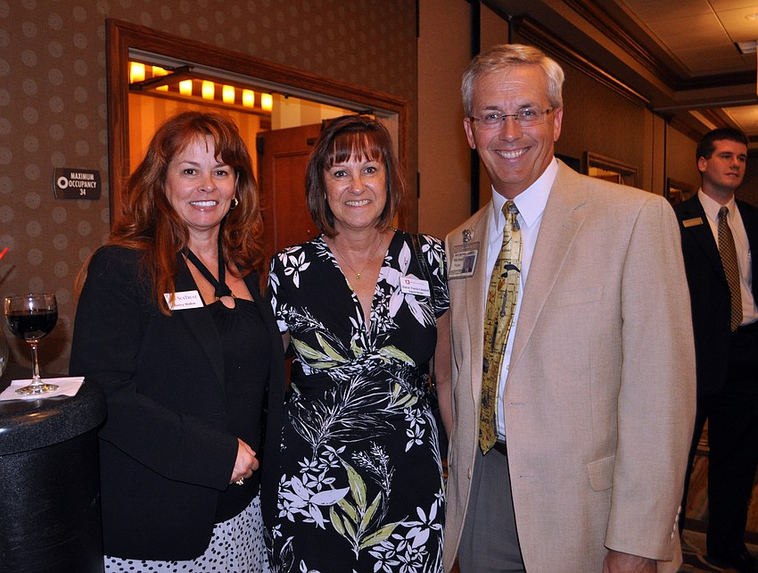 Nancy Walker of SunTrust, Sharon Francis-Campbell of Arrow Bookkeeping and Michael Vejins of Raymond James