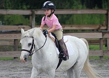 Sierra Yeomans, 4, practiced her jumping position during the show.