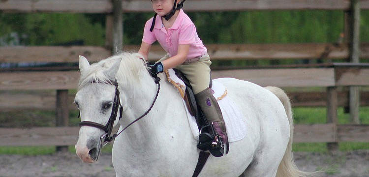 Sierra Yeomans, 4, practiced her jumping position during the show.