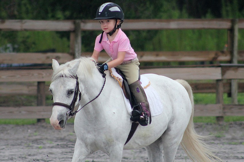 Sierra Yeomans, 4, practiced her jumping position during the show.