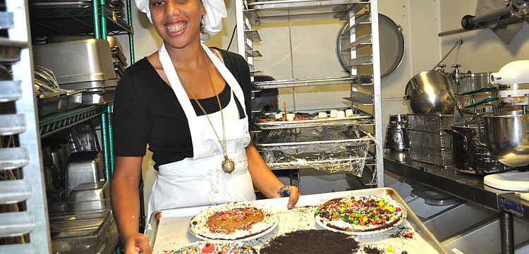 Sierra Hillman shows off a tray of brownies.