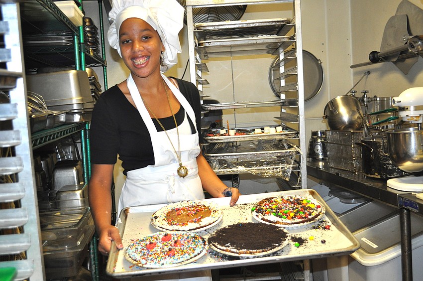 Sierra Hillman shows off a tray of brownies.