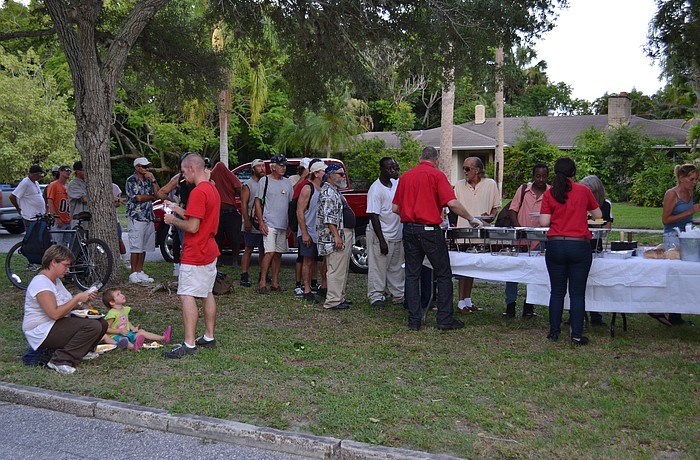 About 40 homeless people were fed in front of Vice Mayor Terry Turner's Cherokee Park home.