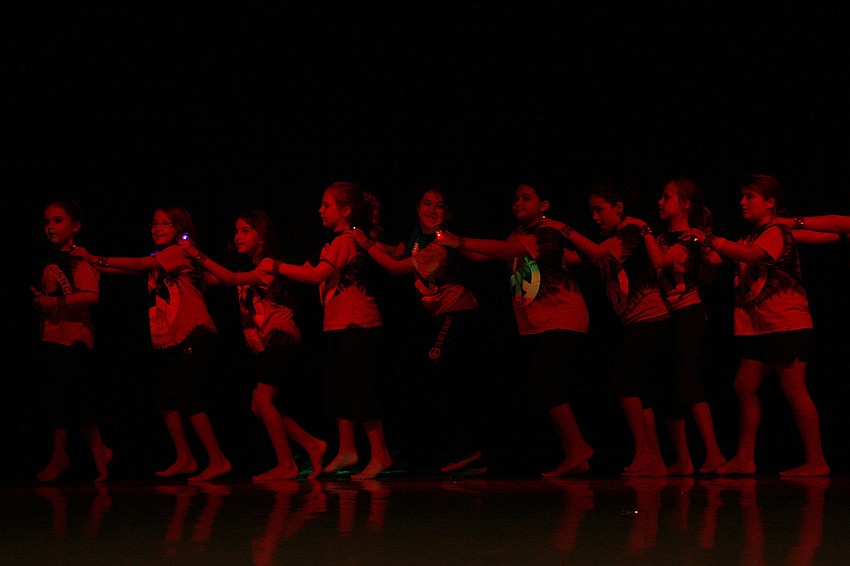 The dancers closed the recital with a conga line.