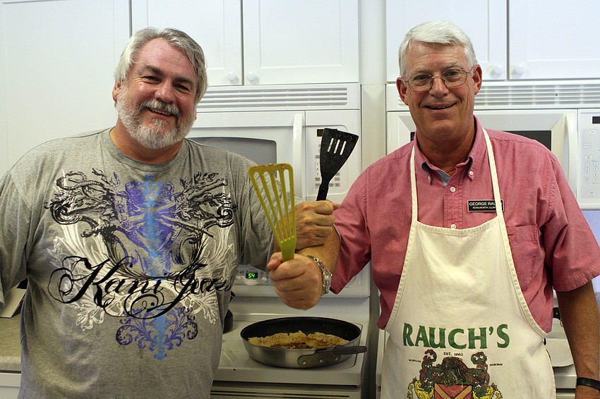 Mark Huber and George Rauch pose in the kitchen while they cooked the 35 fish they caught for the Saturday, July 16 Christ Church and Spanish Main fish fry.