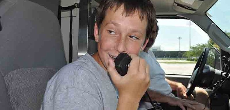 Joe Resnick, 14, had fun singing into the Emergency Response Vehicle's intercom system during a training exercise.